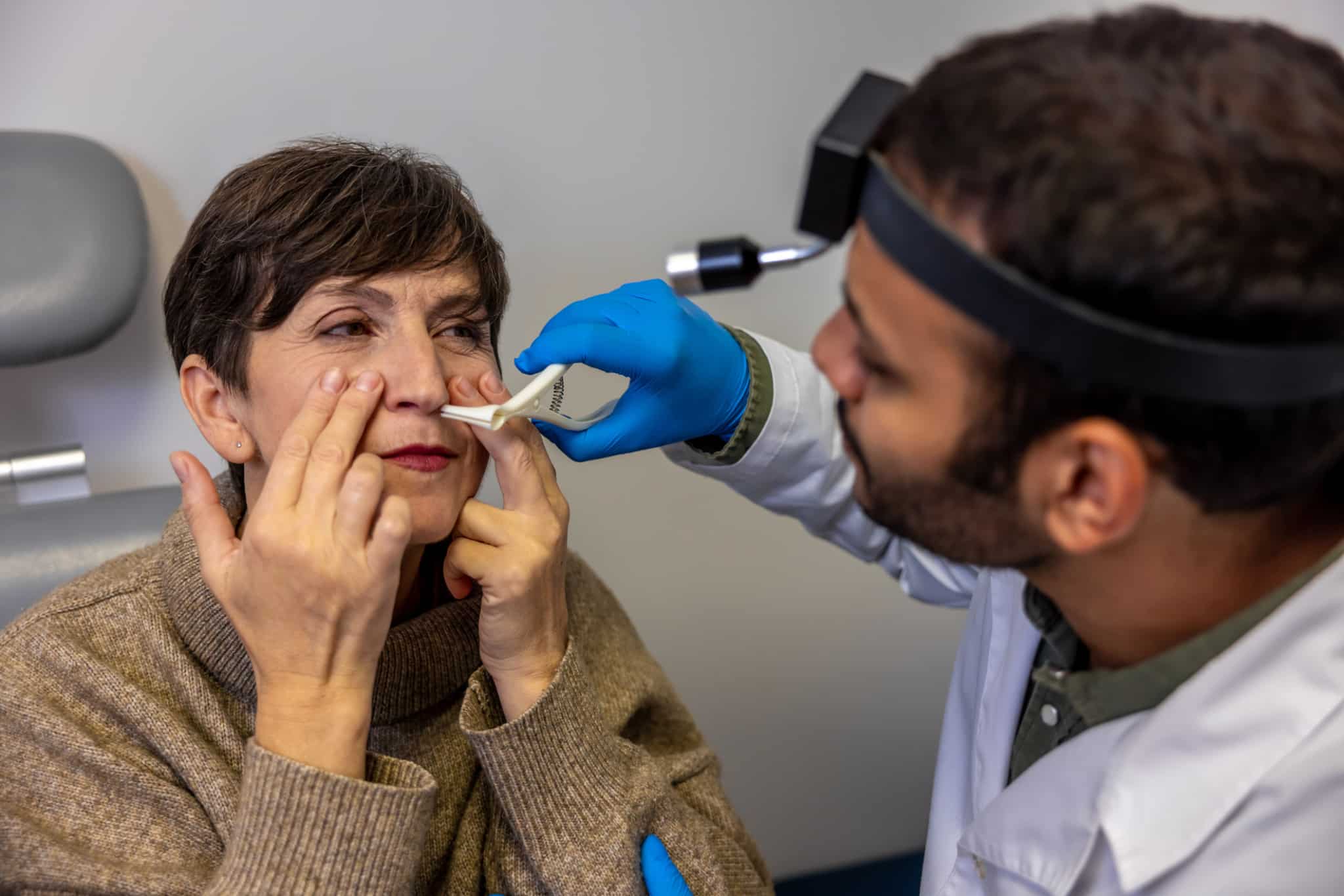 Patient receiving an ear, nose and throat exam at FHCSD